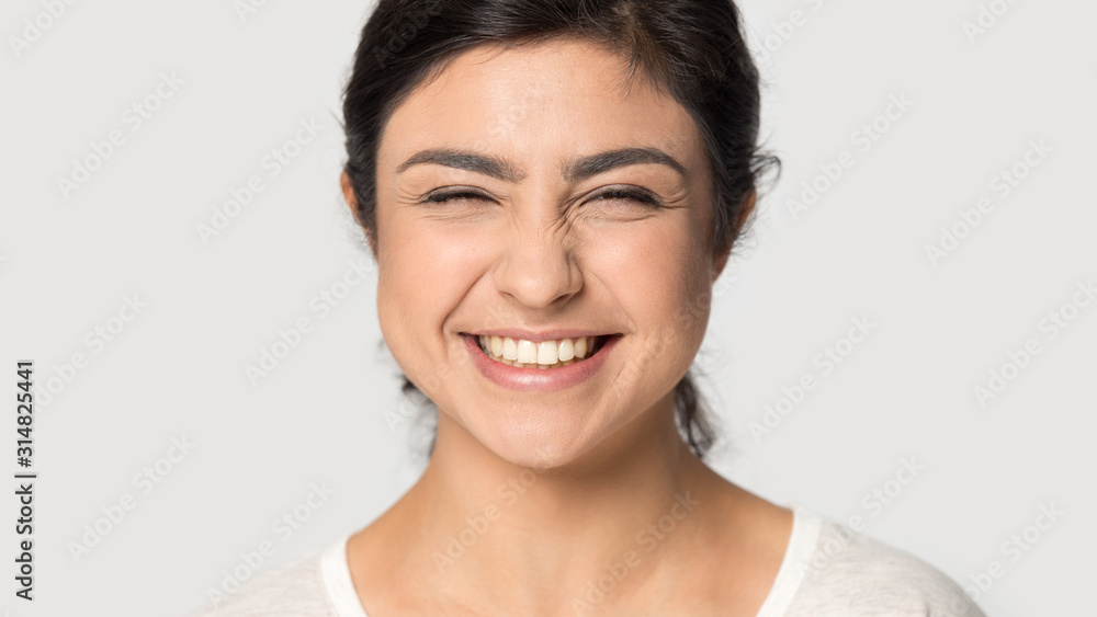 Head shot close up attractive indian woman giggling. Head shot close up attractive indian woman giggling.