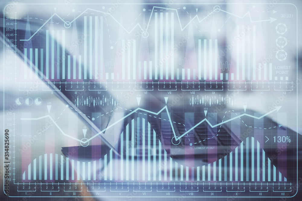 Forex graph hologram on table with computer background. Double exposure. Concept of financial markets. Forex graph hologram on table with computer background. Double exposure. Concept of financial markets.