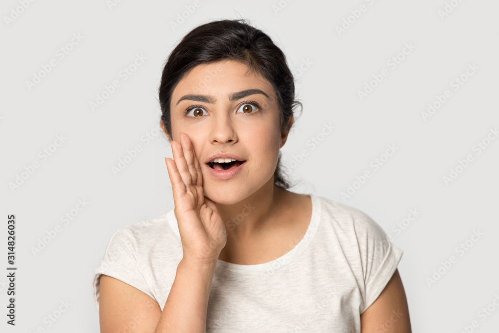 Head shot mysterious indian woman sharing confidential information. Head shot mysterious indian woman sharing confidential information.