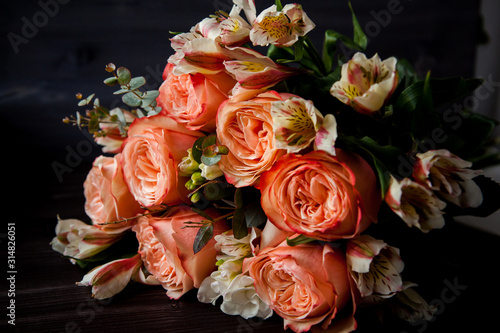 dark luxurious bouquet of gorgeous pink roses for Valentine s day on a dark wood background