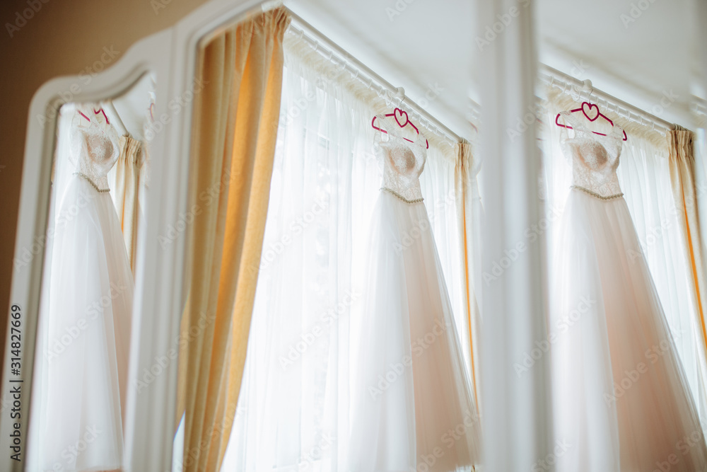Reflection of a wedding dress in the mirror Reflection of a wedding dress in the mirror
