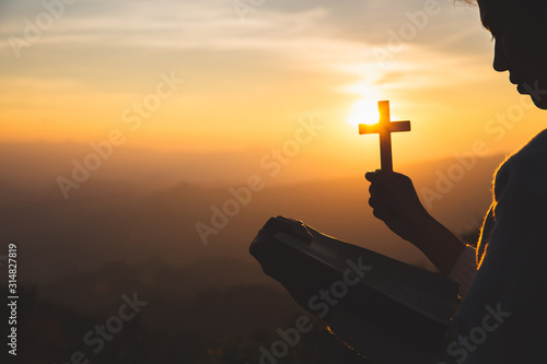 Canvas Print A women is praying to God on the mountain