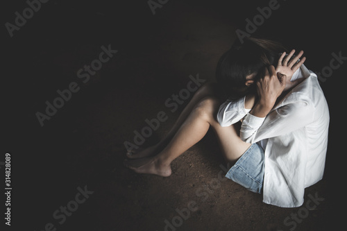 Human trafficking of women, a woman sitting on ground, Sexual violence , sexual abuse and rape.