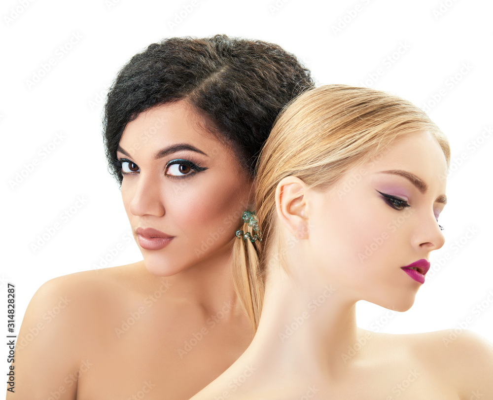 Women in love. Caucasian blond girl and beautiful young girls posing in studio over white background. Fashion, beauty, glam, youth. Makeup. Double female portrait. Homosexual relationship