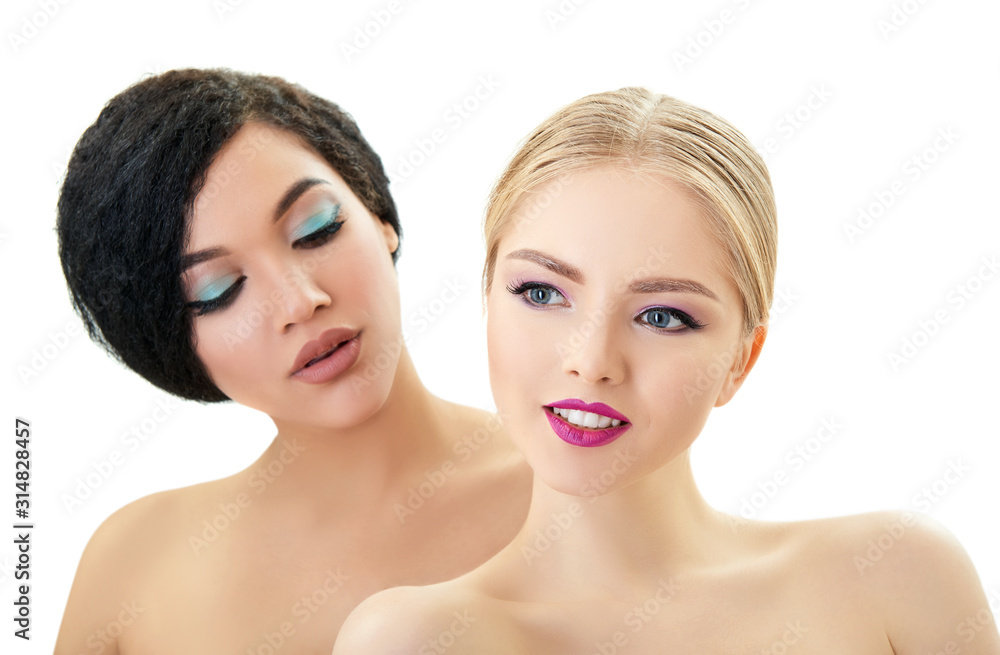 Women in love. Caucasian blond girl and beautiful young girls posing in studio over white background. Fashion, beauty, glam, youth. Makeup. Double female portrait. Homosexual relationship Women in love. Caucasian blond girl and beautiful young girls posing in studio over white background. Fashion, beauty, glam, youth. Makeup. Double female portrait. Homosexual relationship