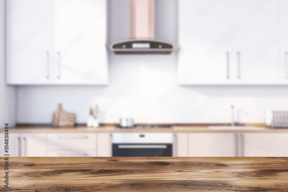 Fototapeta premium Table in blurry white kitchen with countertops