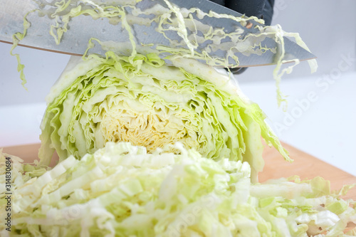 slicing vegetables, cabbage on the board