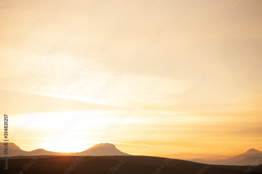 Fototapeta premium Golden sunset in the mountains of the Caucasus.