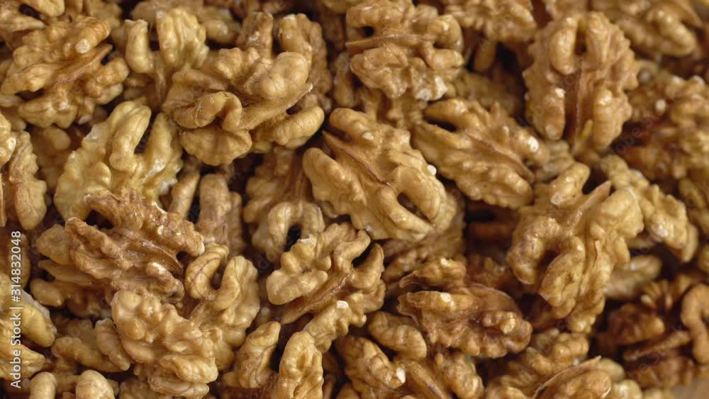 Walnut close up. product rich in minerals and vitamins. Walnut turns in a shot. Hazelnut kernels rotating. Walnut close up lies under beams of the sun. Macro 4K Walnut close up. product rich in minerals and vitamins. Walnut turns in a shot. Hazelnut kernels rotating. Walnut close up lies under beams of the sun. Macro 4K
