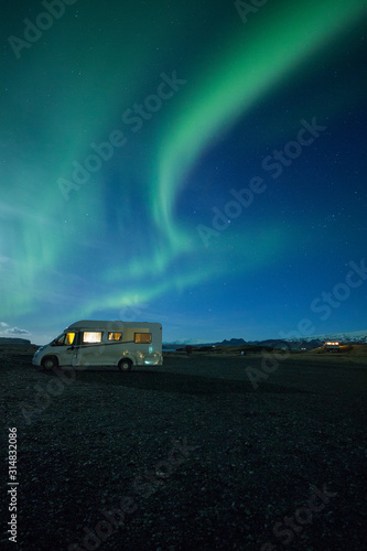 Aurora Borealis (Northern Lights) above a campervan 