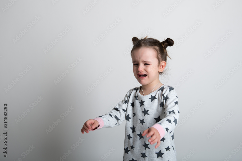Crying little girl. Upset kid. Sad kid portrait. Cute little gilr crying and does not want to go in bed at night Crying little girl. Upset kid. Sad kid portrait. Cute little gilr crying and does not want to go in bed at night
