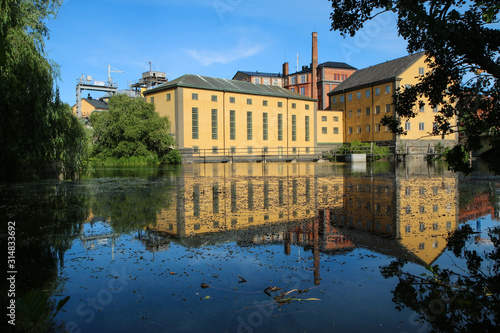 The Industrial center of the city of Norrköping in Sweden. The nice Industrial buildings with typical nordic design surrounded by water. 