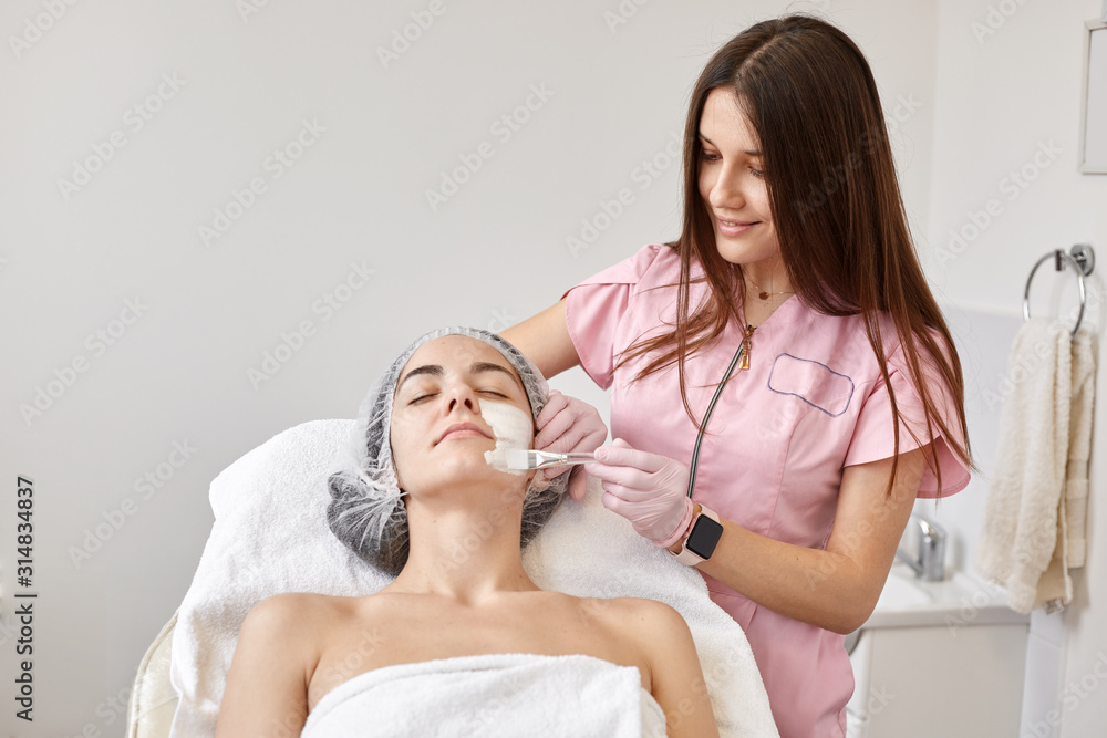Close up shot of relax beautiful young women having clay mask treatment at spa salon, lady spending her leisure time in beauty sarlor. Cosmetology, spa treatment, beauty and healthcare lifestyle.