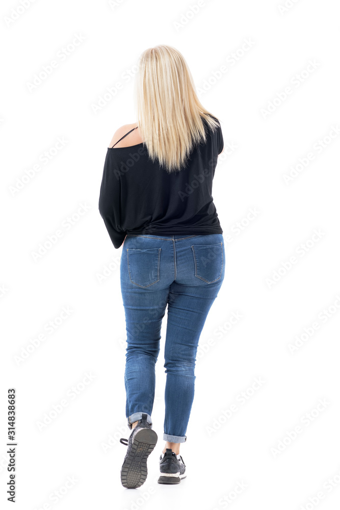 Back view of walking middle age casual woman with blonde hair talking on  the cell phone. Full body length isolated on white background. Stock Photo