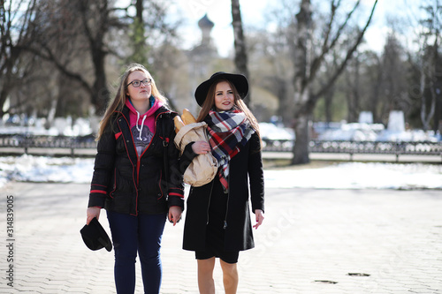 Girl on a walk in sunny weather photo