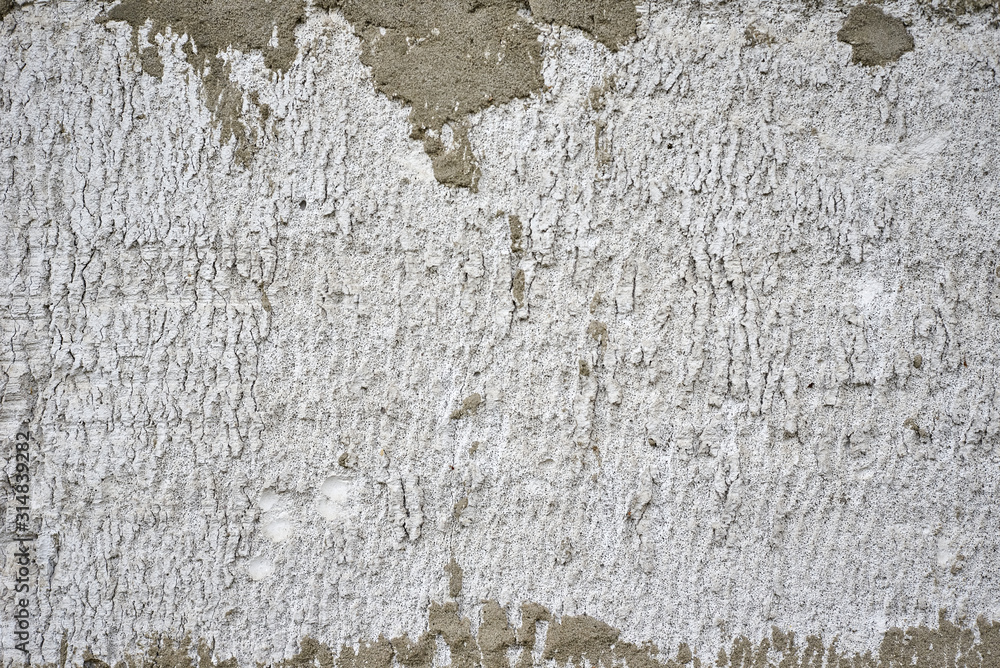 Fototapeta premium Gray concrete wall as background. Stone texture closeup