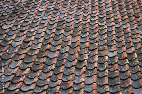 Red, orange, old countryside house roof pattern texture.