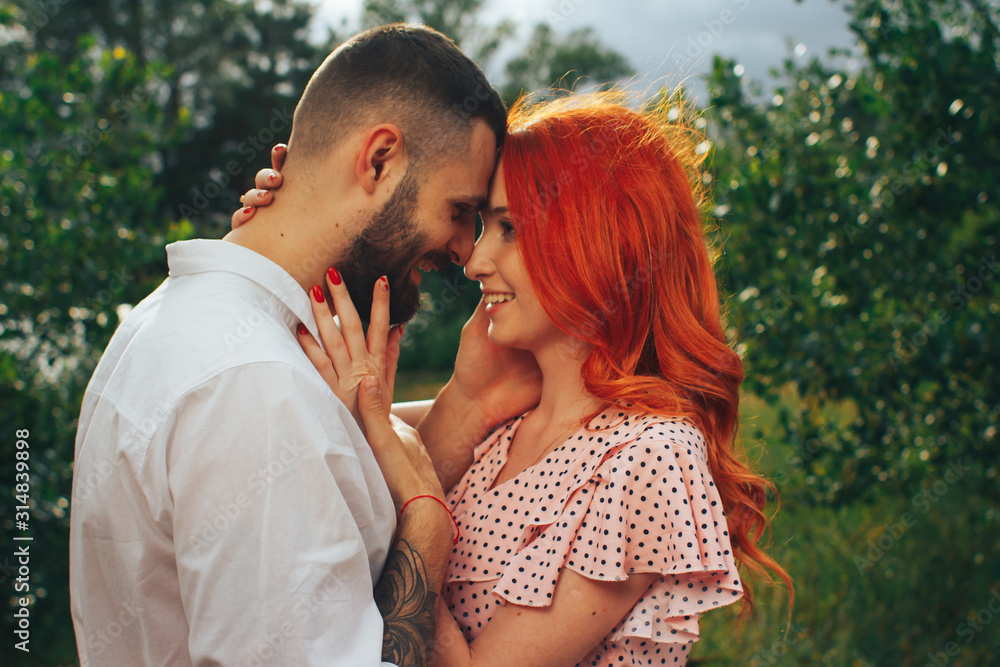 happy, couple in love cuddling, Redhead girl. minute to kiss. date