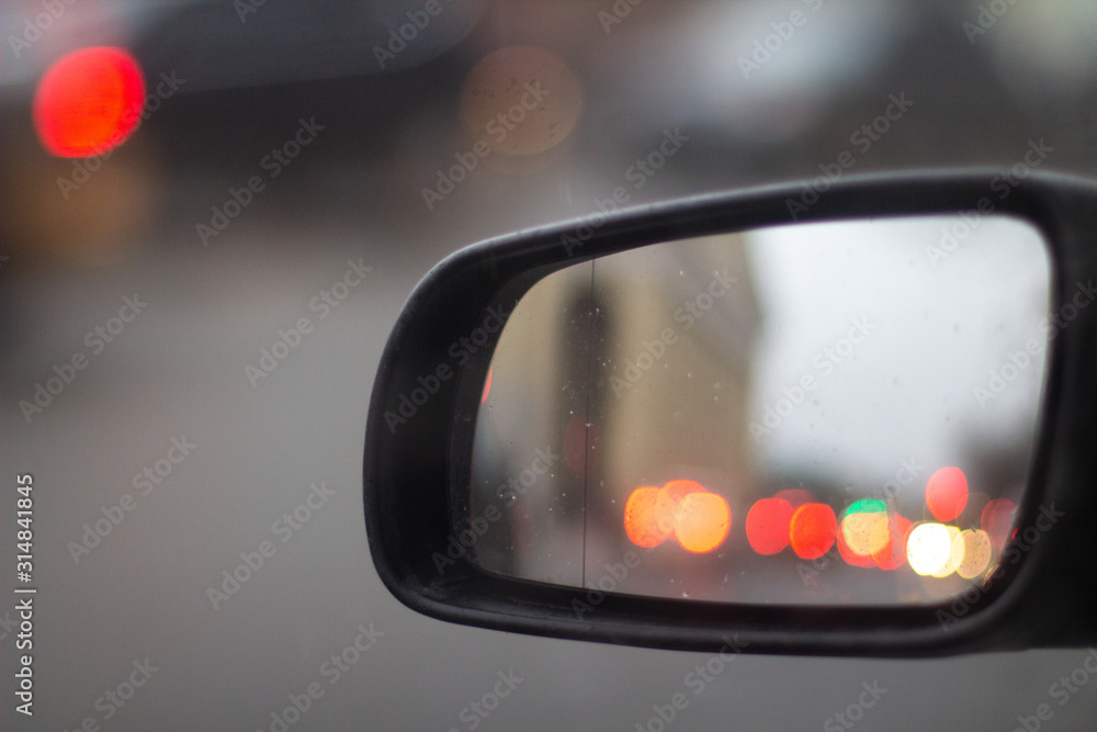 reflections in the rearview mirror of a car