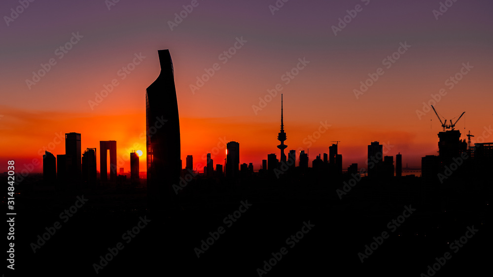 Dark Silhouettes of skyscrapers and buildings - Sunset in Kuwait City - Magenta 