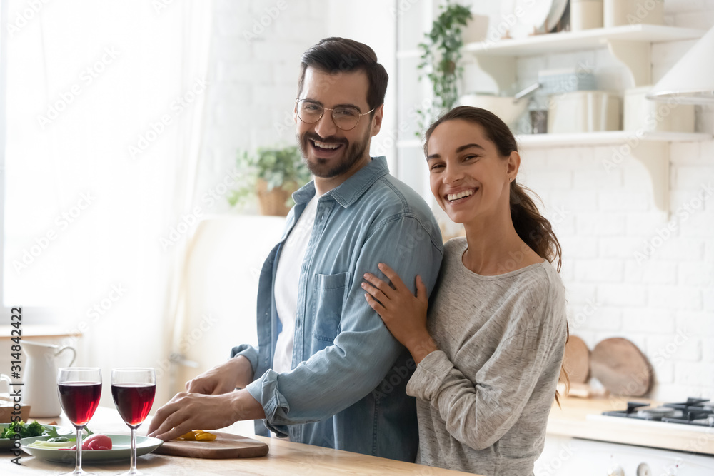 Head shot portrait of happy lovely family couple, preparing dinner. Head shot portrait of happy lovely family couple, preparing dinner.