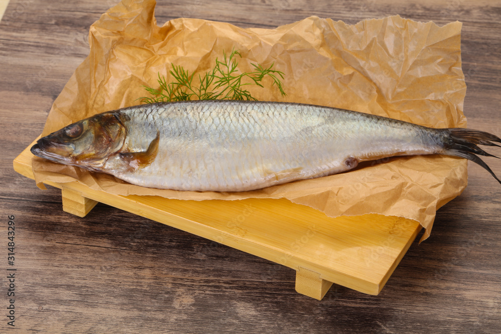 Salted herring over the wooden board Salted herring over the wooden board