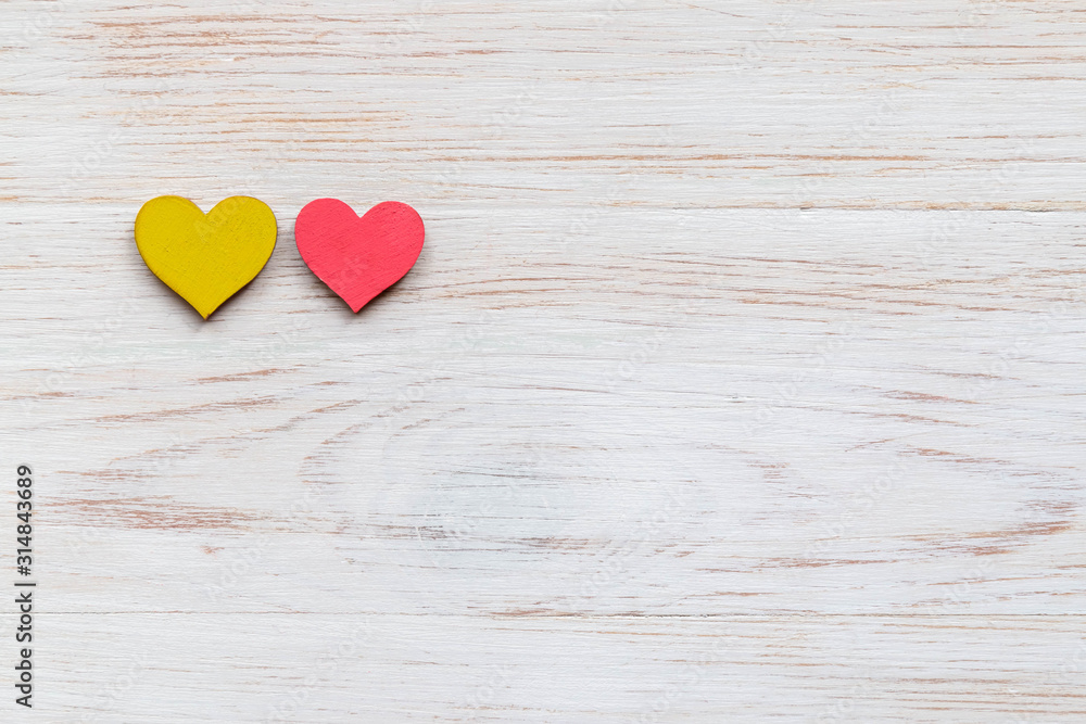 Valentines Day background with two red wooden hearts on wooden planks. Valentine's Day composition Valentines Day background with two red wooden hearts on wooden planks. Valentine's Day composition