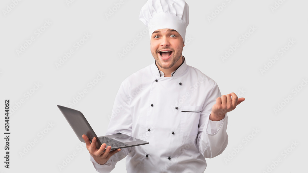 Cook Man Holding Laptop Standing Over White Studio Background, Panorama Cook Man Holding Laptop Standing Over White Studio Background, Panorama