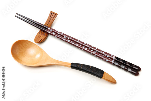 wooden spoon and chopsticks on white background