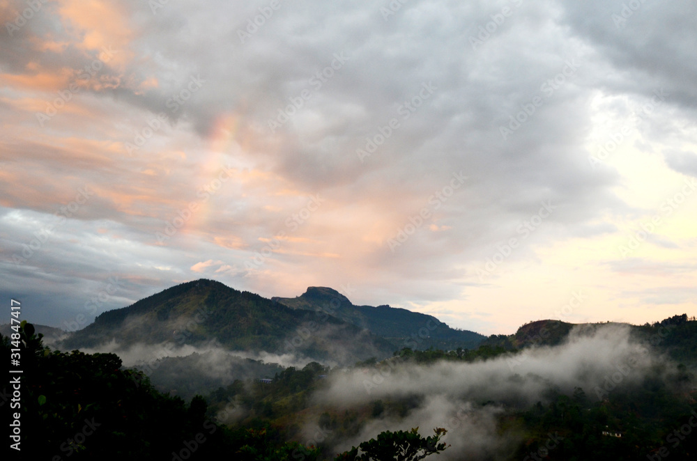 Mist and rainbow after the rain at highland of Sri lanka.
