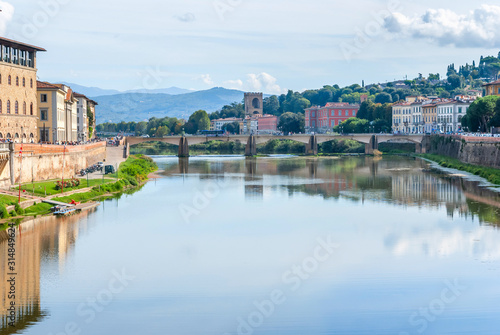 View of stone bridge over Arno river in Florence, Tuscany, Italy.
