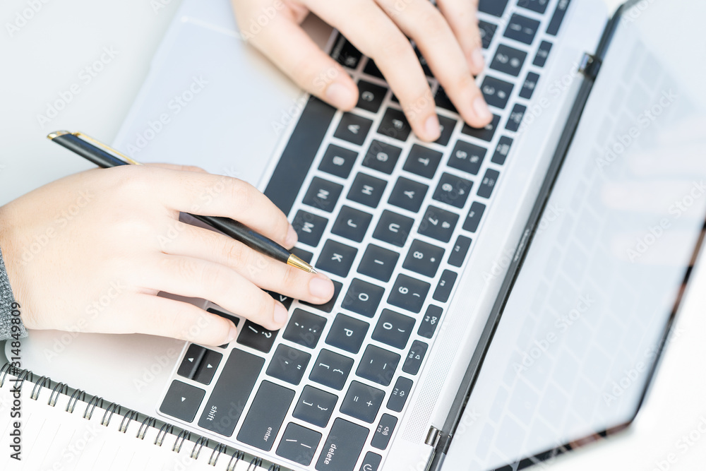 Woman working at home office using laptop searching web, browsing information Woman working at home office using laptop searching web, browsing information