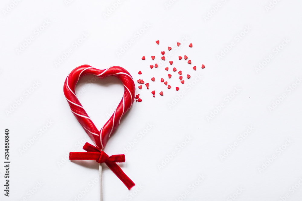 candy Lollipop in the shape of a heart with a scattering of small hearts candy Lollipop in the shape of a heart with a scattering of small hearts
