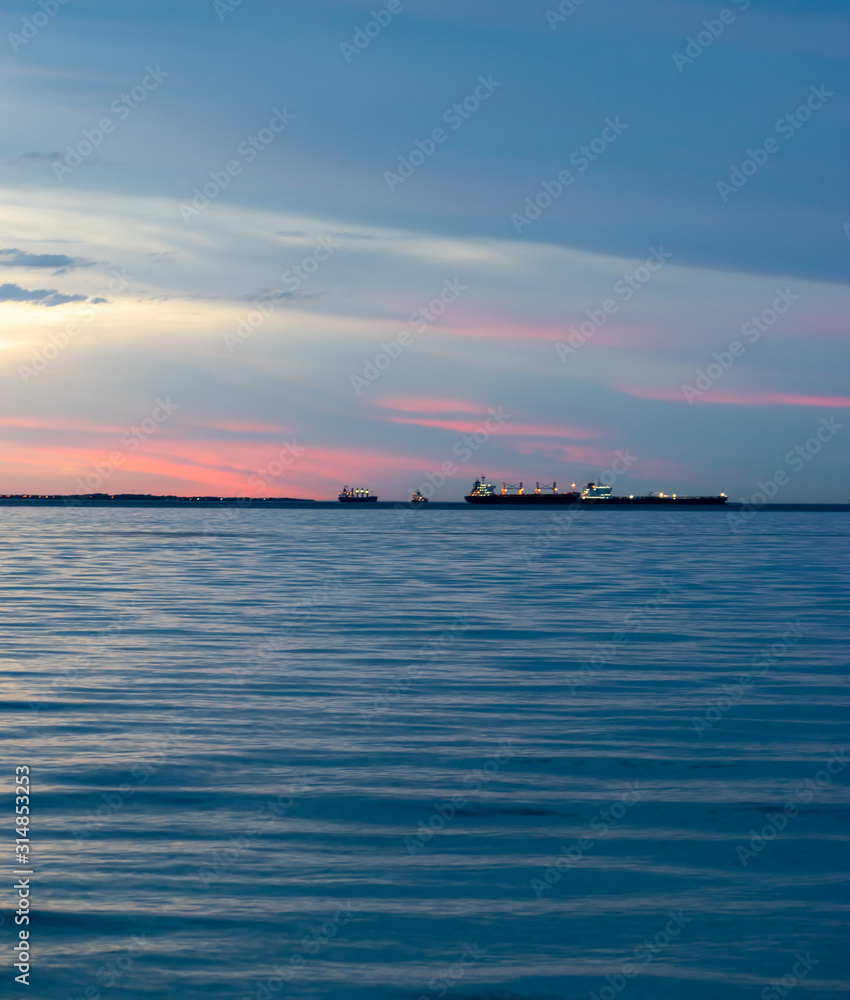 ships on the horizon on dusk ships on the horizon on dusk