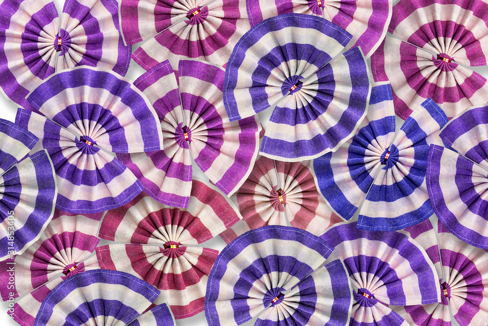 Colorful fabric ribbons flower shape as a background.