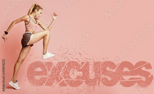 Determined female runner stepping on excuses inscription