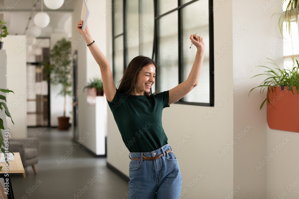 Emotional student girl celebrating successful exam pass - obrazy, fototapety, plakaty 