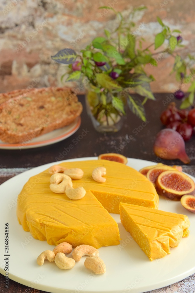 Homemade vegan cheese made from cashew nuts served with gluten free bread Homemade vegan cheese made from cashew nuts served with gluten free bread
