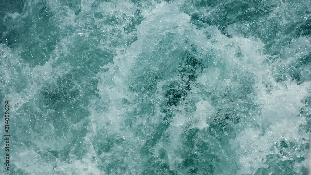 speed tourist motorboat sails in emerald sea making white foamy trace waves close view