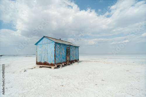 Old house for workers on a salt lake © grek881
