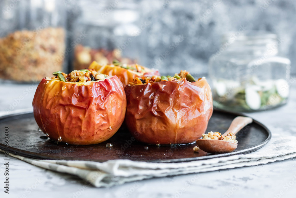 Baked apples with nut granola and pumpkin seeds. Baked apples with nut granola and pumpkin seeds.