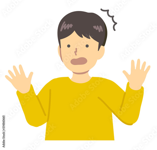 黄色い服を着た驚く男の子