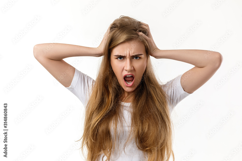 Portrait of young angry woman screaming on white background Portrait of young angry woman screaming on white background