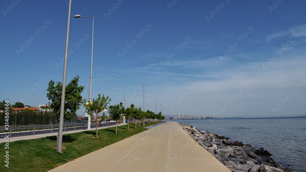 Walking path on the waterfront with beautiful views of the sea and the city.