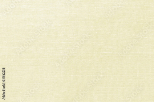 Cream yellow handmade natural cotton, linen old fabric textile cloth in light white vintage retro color for abstract background