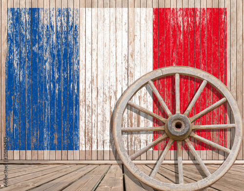 wheel on wooden background, French flag