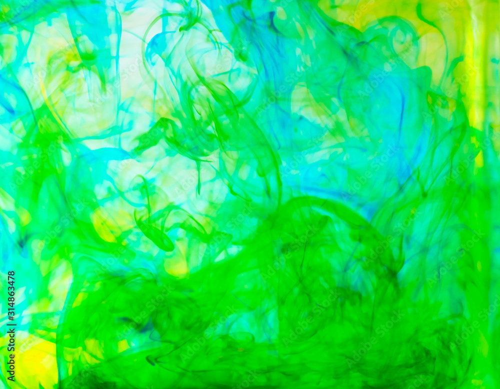 Blurred photo of food color drop and dissolve in water for background and texture concept. Blurred photo of food color drop and dissolve in water for background and texture concept.