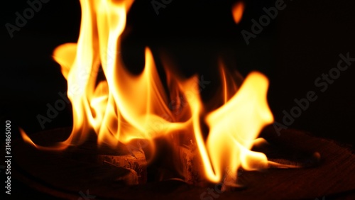 Fire, flames on a black background isolate. Concept fire grill heat weekend barbecue, Flame heat fire abstract background black background. Dangerous concept 