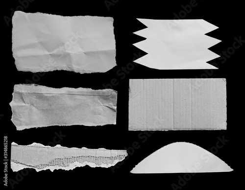 Set of torn paper texture on black background, copy space.