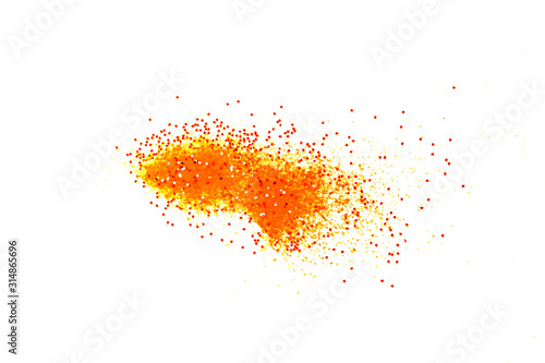 Orange glitter powder and sand color splash or burst isolated on white